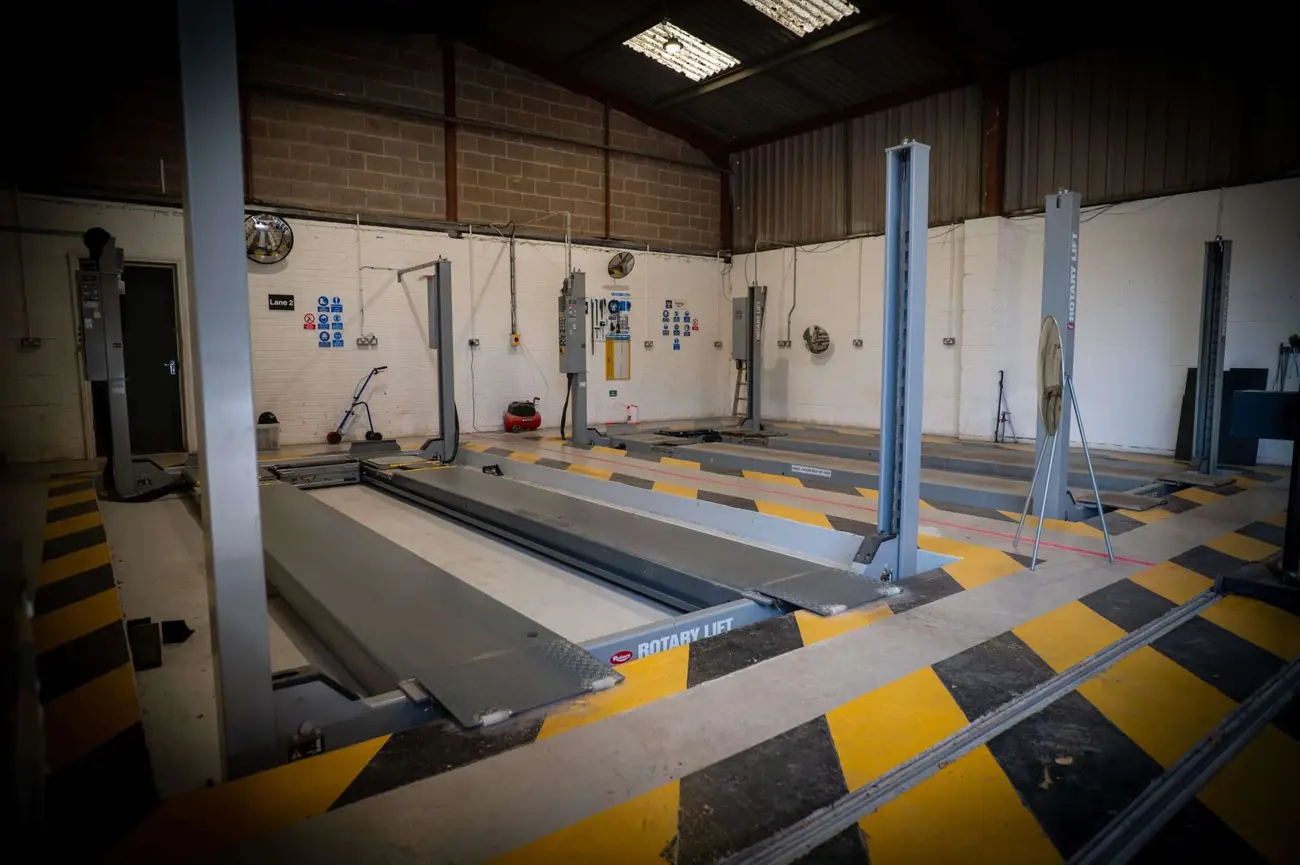 An empty vehicle test lane inside the My Car Import building in Castle Donington