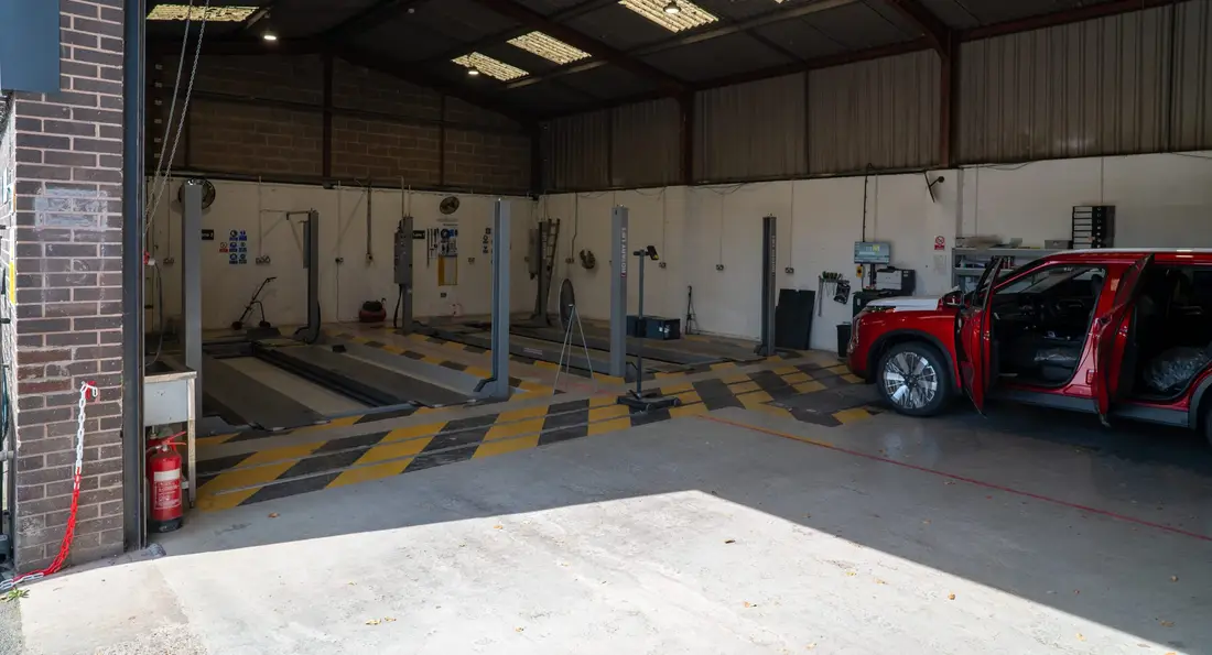 The IVA test lane at My Car Import, with a red SUV waiting at the door