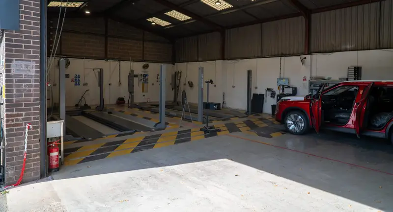 The IVA test lane at My Car Import, with a red SUV waiting at the door